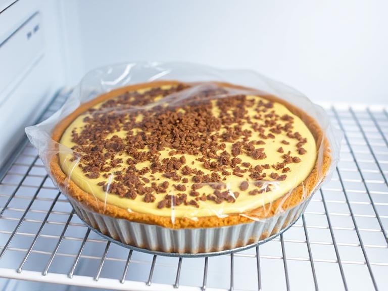 Butterfinger Pie chilling in the refrigerator to set before serving.